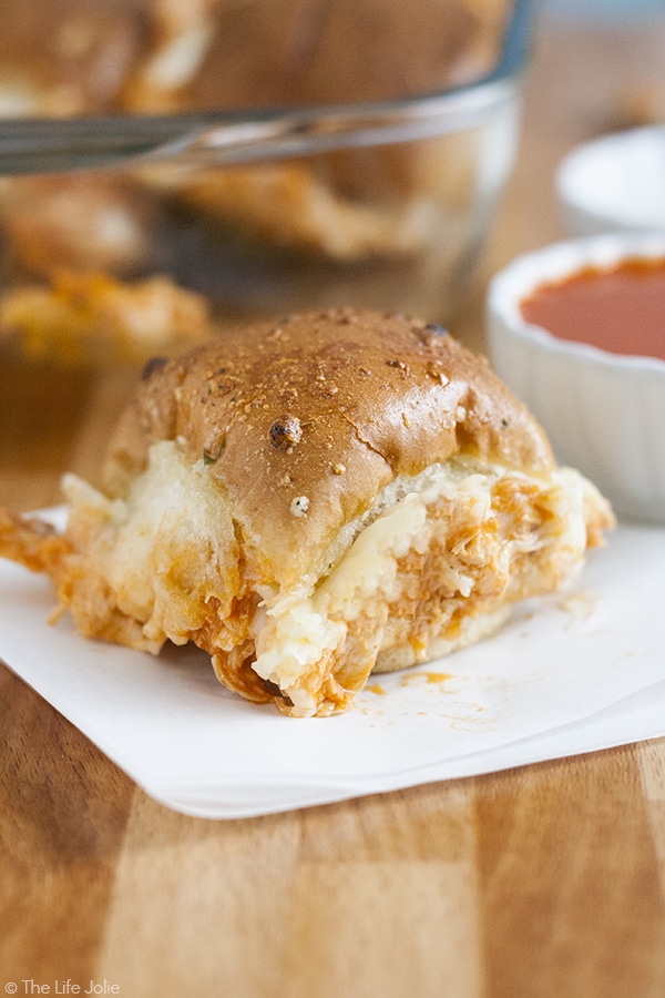 These Quick and Easy Baked Buffalo Chicken Sliders are one of my favorite game day recipes! They come together lightning fast in the oven with a few simple ingredients like shredded chicken, ranch, buffalo sauce, mozzarella cheese and buns. They are the best appetizer to bring to any party!!