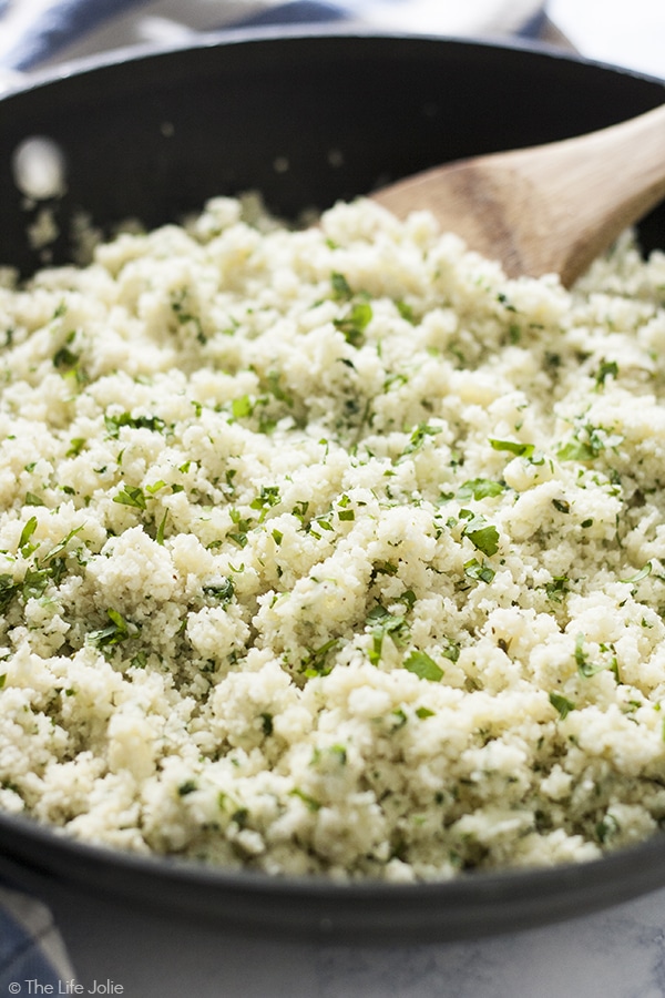 Cilantro Lime Cauliflower Rice is such an easy, low carb side dish. With cauliflower, garlic, cilantro and lime juice it cooks up really quickly and tastes especially great with Mexican food. This is definitely one of my new favorite healthy recipes!