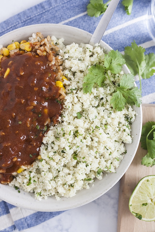 Cilantro Lime Cauliflower Rice is such an easy, low carb side dish. With cauliflower, garlic, cilantro and lime juice it cooks up really quickly and tastes especially great with Mexican food. This is definitely one of my new favorite healthy recipes!
