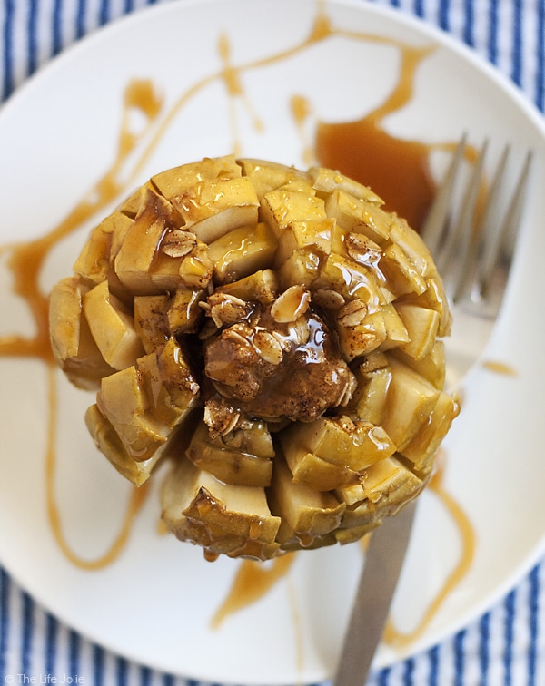 This Bloomin' Baked Caramel Apples recipe is the perfect fall dessert! They're quick and easy to make and deliciously sweet! 