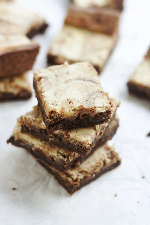 These homemade German Cream Cheese Brownies are a delicious addition to any holiday cookie platter. This recipe is made from scratch but SO easy! Rich chocolate brownies swirled with sweet cream cheese helps make this a decadent treat your family will love!