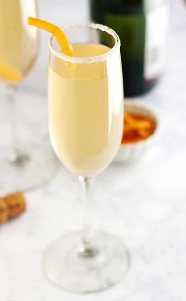 This Grapefruit Sparkler is a festive champagne cocktail! I love adult beverages featuring sparkling wine and this is simple to make and refreshing to drink at brunch or to ring in the New Year. This pretty drink will be a mainstay at your next girls night!