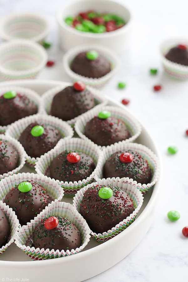 These M&M's Brownie Truffles are an easy chocolate dessert recipe and an excellent gift to give this holiday season. It's a super-simple recipe made with rich, fudgy brownies and a surprise in the middle. These are a pretty addition to any Christmas cookie platter that the whole family will love!