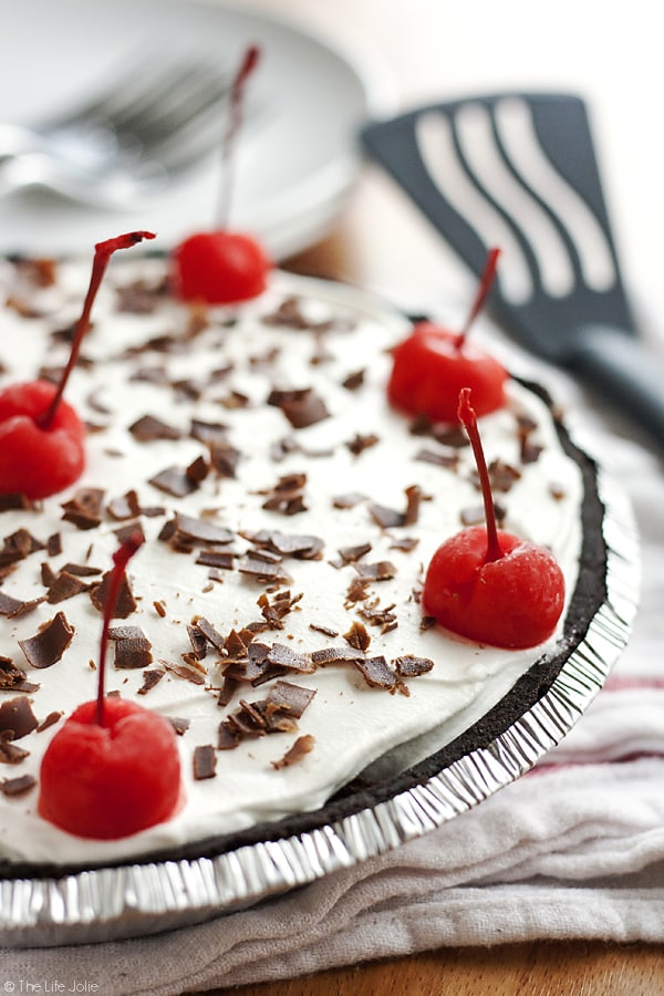 This Black Forest Ice Cream Pie is a quick and easy no bake dessert recipe. Made with an Oreo Cookie crust, chocolate ice cream, maraschino cherries and whipped topping this pie is a pretty addition to any dessert table! It's perfect for the holidays or to keep in the freezer "just because"!