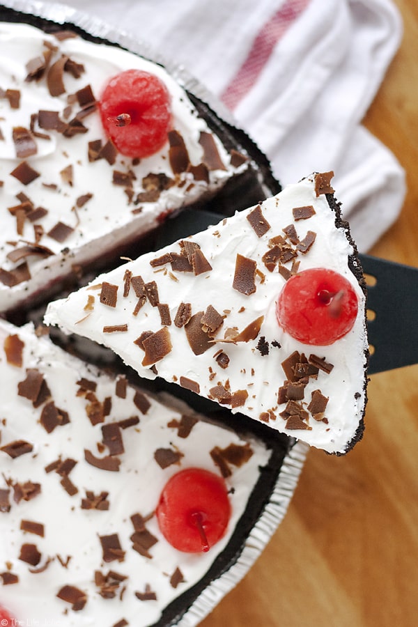This Black Forest Ice Cream Pie is a quick and easy no bake dessert recipe. Made with an Oreo Cookie crust, chocolate ice cream, maraschino cherries and whipped topping this pie is a pretty addition to any dessert table! It's perfect for the holidays or to keep in the freezer "just because"!
