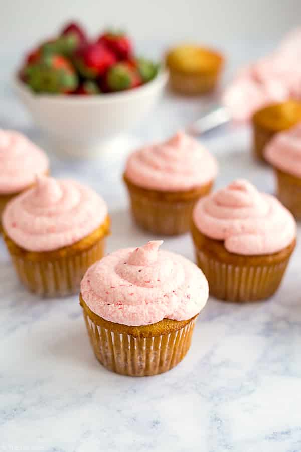 These are the best Vanilla Cupcakes! They're really easy to make from scratch and taste great with Fresh Strawberry Buttercream Frosting (also homemade!). This recipe makes moist and delicious cupcakes with the most light and fluffy frosting!