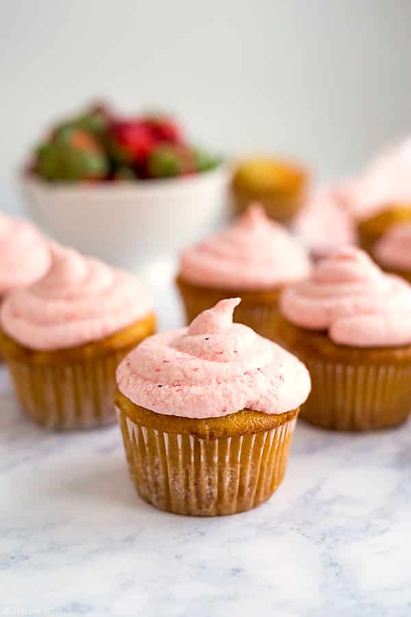 These are the best Vanilla Cupcakes! They're really easy to make from scratch and taste great with Fresh Strawberry Buttercream Frosting (also homemade!). This recipe makes moist and delicious cupcakes with the most light and fluffy frosting!