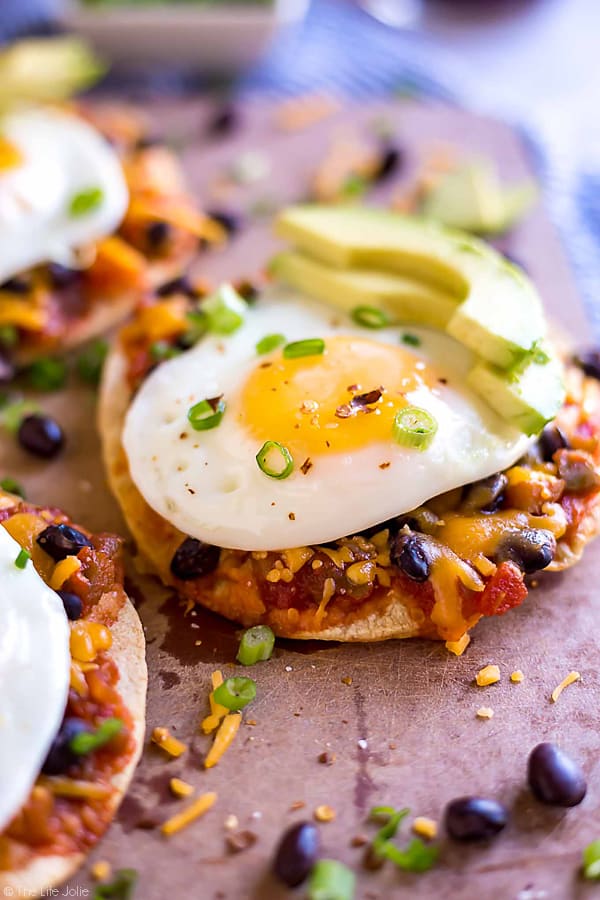 Baked Breakfast Tostadas are one of my favorite easy recipes to make for breakfast (or lunch- or brunch!). This is simple cooking at it's finest with corn tortillas, salsa, black beans, cheese and eggs. You can get creative and take it in whatever direction you'd like- this quick and delicious dish is definitely a keeper!