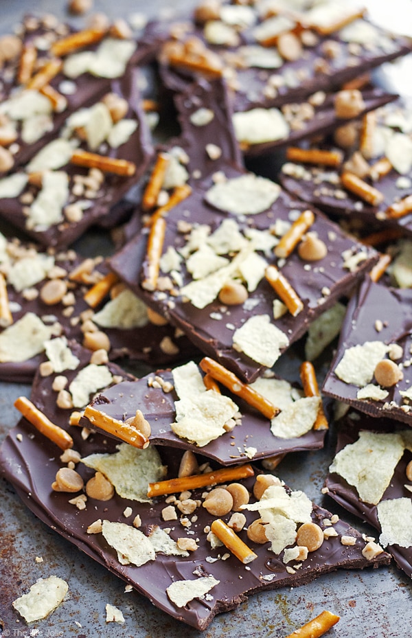 This PMS Bark is the ultimate treat to fulfill both your sweet and salty cravings! Made with rich dark chocolate, salty potato chips and pretzels, peanut butter chips and buttery toffee bits, this recipe is SO easy to make and really addictive- you won't be able to get enough!!