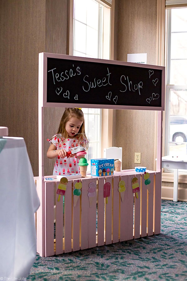 This DIY Play Stand is an imaginative toy to keep your kids entertained! It can be a lemonade stand, an ice cream stand, a market- the possibilities are endless! Your kids will have hours of fun with this easy to make and inexpensive project!