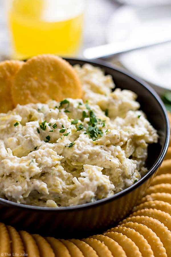 This Artichoke Asiago Dip is the best easy recipe to throw together for a last-minute spring get-together. It only takes a couple of minutes to make and is fully of cheesy, delicious flavor! #ad