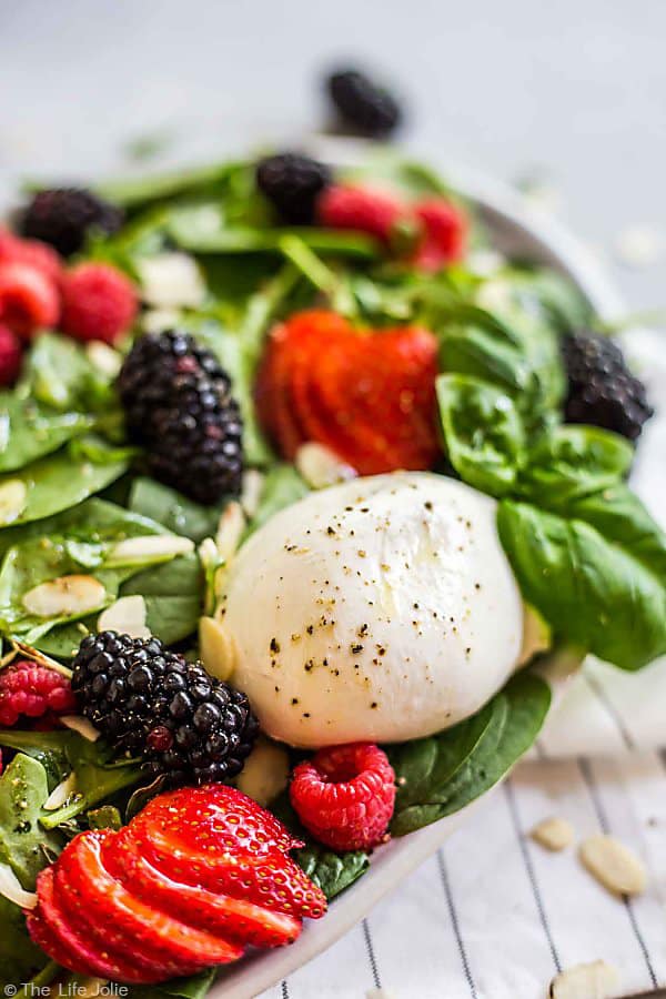 A close up of the Burrata cheese in this Summer Berry and Burrata Salad.