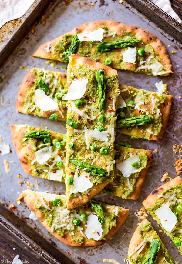 An overhead photo of Pea Pesto Flatbread slices with one slice on top of the others.