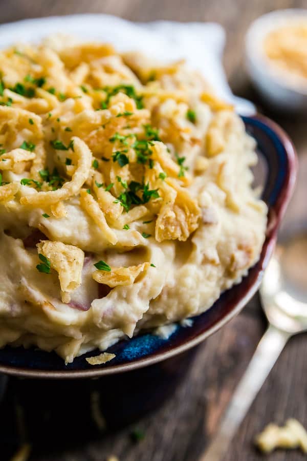 A close up image of a bowl of French Onion Creamy Mashed Potatoes
